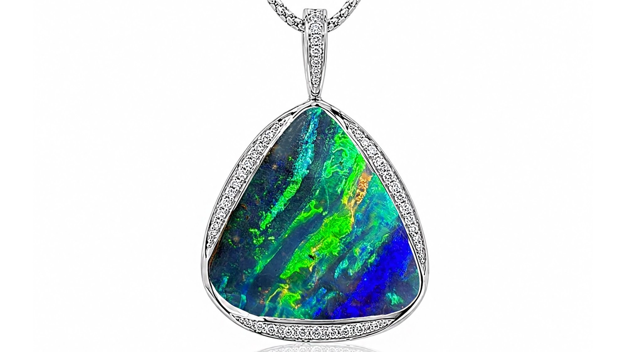 Australian boulder opal pendant set in a silver necklace with vivid blue and green colours